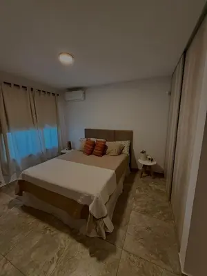 a bedroom with a large bed in a room at Estilo y Relax en Manantiales ll in Cordoba