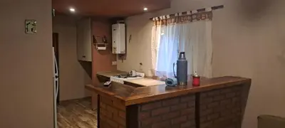 a kitchen with a counter with a sink and a window at Buena tierra in Arroyo de Los Patos