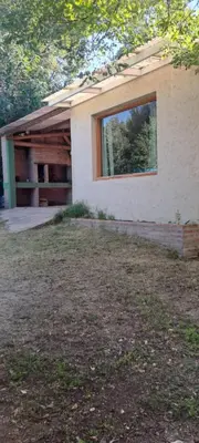 a house with a window on the side of it at Buena tierra in Arroyo de Los Patos