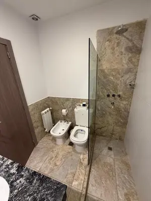 a bathroom with a toilet and a sink and a shower at Estilo y Relax en Manantiales ll in Cordoba