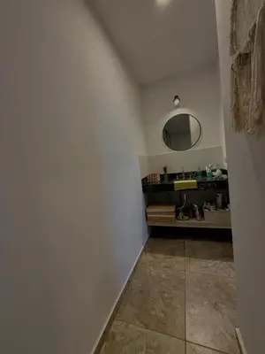 a bathroom with a sink and a mirror at Estilo y Relax en Manantiales ll in Cordoba