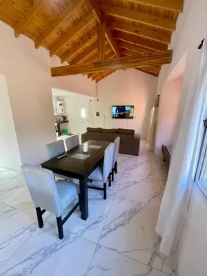 a dining room with a table and chairs at Las Mariposas in Merlo