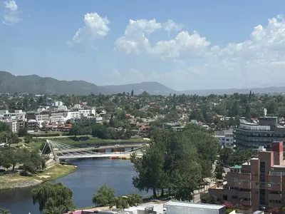 a view of a city with a bridge over a river at Hermoso departamento en el Centro de Carlos Paz in Villa Carlos Paz