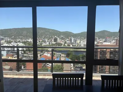 a view of a city from a window at Hermoso departamento en el Centro de Carlos Paz in Villa Carlos Paz