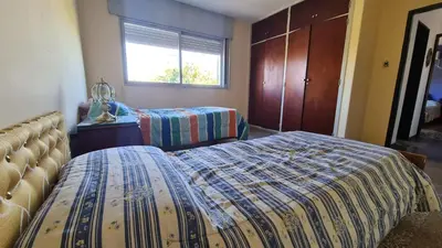 a bedroom with two beds and a window at El Tesoro Cordobés in Cordoba