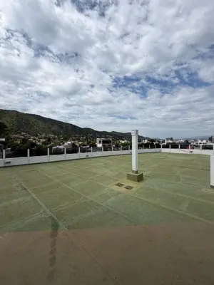 a large tennis court on the roof of a building at Departamento Carilo in Villa Carlos Paz