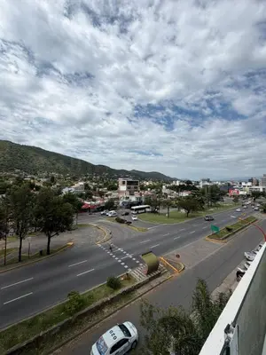 a view of a street with cars on the road at Departamento Carilo in Villa Carlos Paz