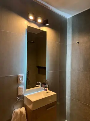 a bathroom with a sink and a mirror at Departamento Nueva Córdoba in Cordoba
