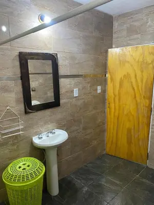 a bathroom with a sink and a mirror at Short-Term Rental in Bialet Massé