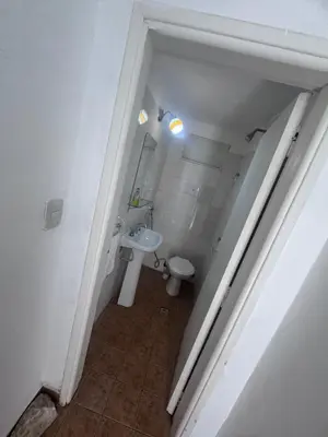 a small bathroom with a sink and a toilet at Colonia 25 de Mayo in Villa Carlos Paz