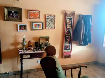a person sitting at a desk in a room at La casa de Ale in Cordoba