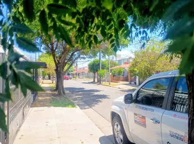 a white car parked on the side of a street at La casa de Ale in Cordoba