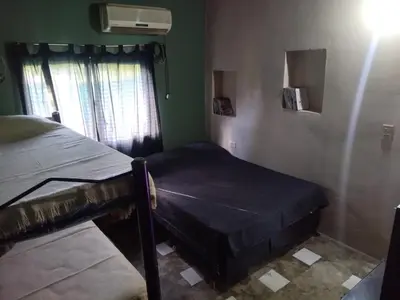a small room with a bed and a window at Dptos victoria in Mina Clavero