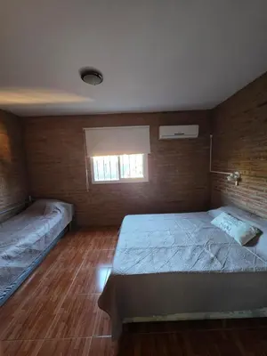 a bedroom with a bed and a window at Complejo de departamentos 7 Cielos in Villa Carlos Paz