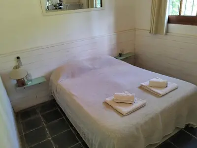 a room with a bed with two towels on it at Casita Santa Elena N3 in Trapiche