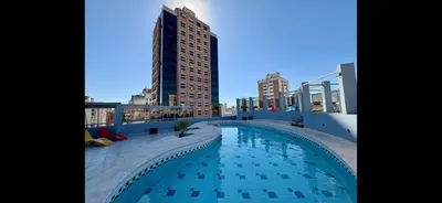 a swimming pool on the roof of a building at VILAUT Great studio, strategic location with Pool, Gym and Coworking area in Cordoba