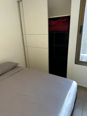 a bedroom with a bed and a closet at Departamento Duarte Quiros 274 in Cordoba