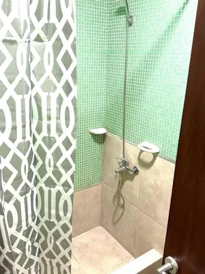 a bathroom with a shower with a glass door at Departamento Barrio General Paz in Cordoba