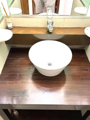 a white sink in a bathroom with a mirror at Departamento Barrio General Paz in Cordoba
