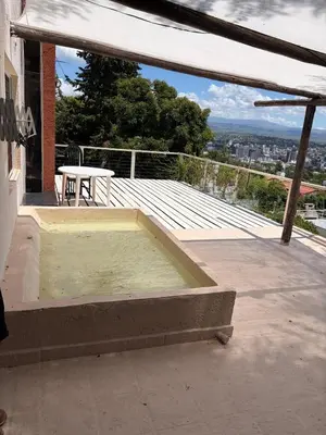 a hot tub sitting on top of a patio at Depto Vista panoramica in Villa Carlos Paz