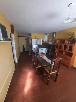 a kitchen and dining room with a table and chairs at CASA PARA 6 PERSONAS - Mis Dos Soles in Mina Clavero
