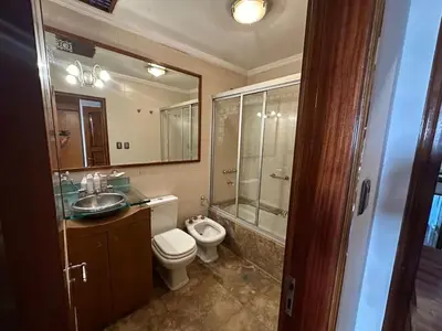 a bathroom with a toilet and a sink and a shower at Casa en CORDOBA in Cordoba