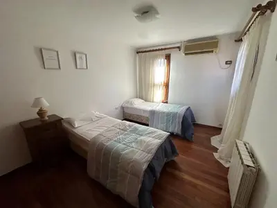 a room with two beds and a window in it at Casa en CORDOBA in Cordoba
