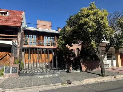 a building with a gate on the side of a street at Casa en CORDOBA in Cordoba