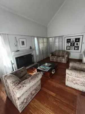 a living room with two couches and a fireplace at Bienvenidos a casa in Cordoba