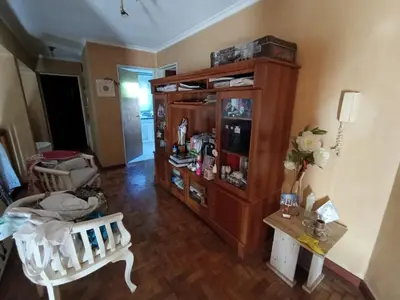 a living room with a cabinet and a table at Bienvenidos a casa in Cordoba