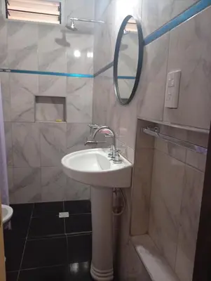 a bathroom with a sink and a mirror at Cabañas los Materos 3 in Santa María
