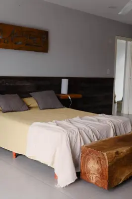 two beds sitting next to each other in a bedroom at Complejo Palo Blanco in Villa Carlos Paz
