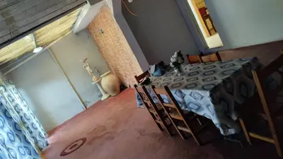 a dining room with a table and some chairs at casa para cosquin rock in Santa María