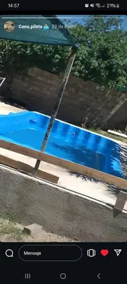 a screenshot of a picture of a swimming pool at Cabañas Sucot in Tanti