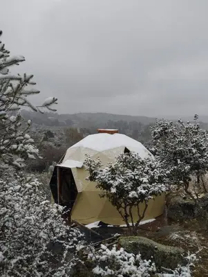 a tent sitting on top of a snow covered hill at Goodkarma in Tanti