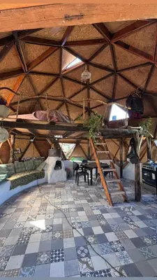 a large room with a tiled floor and a ceiling at Goodkarma in Tanti