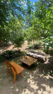 a picnic table and a bench in a park at La Matera, San Clemente, Córdoba in San Clemente