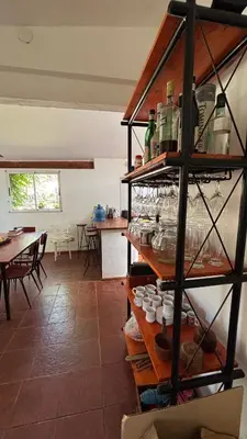 a kitchen and dining room with a table and chairs at La Matera, San Clemente, Córdoba in San Clemente