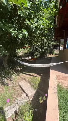a hose is tied to a tree in a yard at La Matera, San Clemente, Córdoba in San Clemente