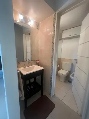 a bathroom with a sink and a toilet at Departamento en complejo residencial entero en Córdoba, Argentina in Cordoba
