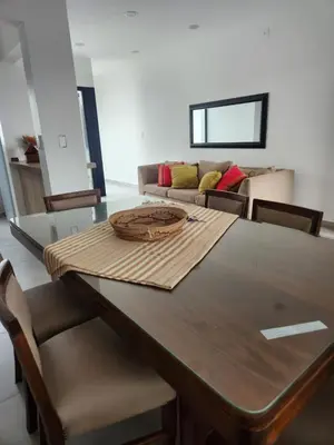 a dining room table with chairs and a couch at Departamento macrocentro I, espacioso Río Cuarto in Río Cuarto