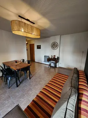 a living room with a couch and a table at Depto Victoria in Cordoba