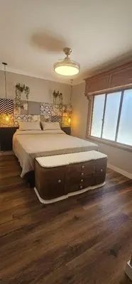 a bedroom with a large bed and a large window at Apartment in the historic center in Cordoba