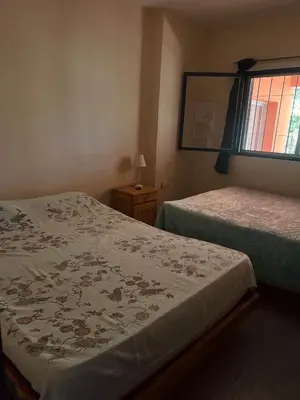 a bedroom with two beds and a window at Mar y Mar Naturaleza y comodidad in La Estancia