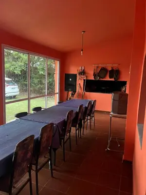 a conference room with a long table and chairs at Mar y Mar Naturaleza y comodidad in La Estancia