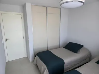 a small bedroom with a bed and a closet at Opera Park en Barrio Las Rosas in Cordoba
