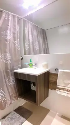 a bathroom with a sink and a shower curtain at NUEVA CORDOBA, Zona PLAZA ESPAÑA PARQUE SARMIENTO in Cordoba