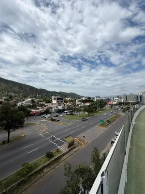 a view of a highway with a city in the background at Depto Carillo 4p in Villa Carlos Paz