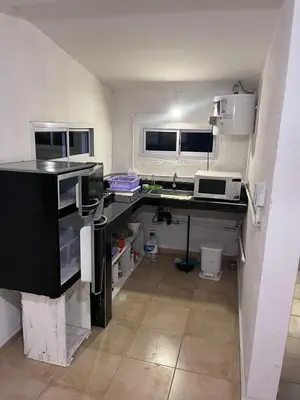 a kitchen with a sink and a counter top at Sami LLankay II in Villa Ciudad Parque