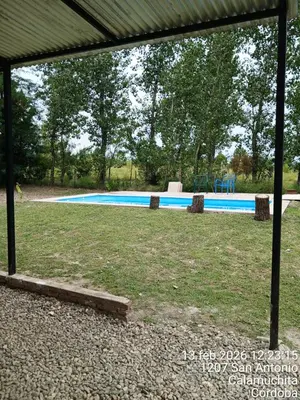 a swimming pool in the middle of a yard at Sami LLankay II in Villa Ciudad Parque